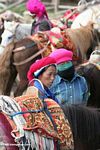 Young Tibetan women waiting with horses