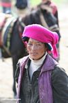 Tibetan woman with a fuchsia head scarf
