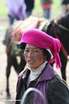 Tibetan woman with a fuchsia headscarf