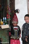 Chinese girl and boy working at a stand near a passport checkpoint on the Karakoram highway