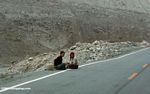 Two girls sitting along the Karakoram highway