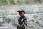 Tajik boy tending to a patch of sunflowers