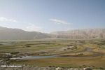 Two Tajiks standing on an open plain in the Kunlun mountains