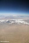 Aerial view of desert and snow-capped mountains in western China