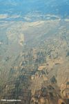 Airplane view of mountains and agricultural fields near Urumqi