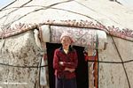 Uighur woman in front of her yurt