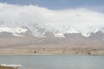 Snow-capped mountains and glaciers behind Karakul Lake