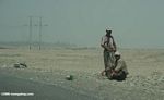Men on roadside in a Chinese desert