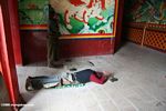Tibetan pilgrim prostrating at Sumtsanlang monastery