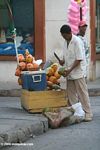 Man preparing a coconut in old Cartagena