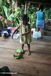 Ticuna child playing with a plastic toy