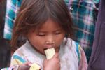 Hmong girl eating a banana