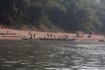 People arranging boat transport along the Nam Ou river