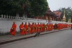 Morning alms during the procession of monks