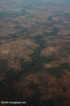 Aerial photos of forest fragments and riparian forest strips on an otherwise deforested plain in Southern Laos