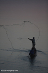 Fisherman at dawn on the Mekong