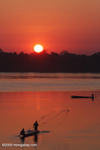 Men fishing on the Mekong as the sun comes up