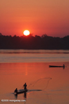 Men fishing on the Mekong as the sun rises