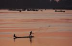 Men fishing on the Mekong as the sun comes up