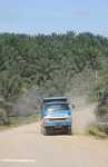 Truck driving through an oil palm plantation -- borneo_5075