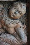Stone carving of a croaching figure at Wat Phra That Pu Khao