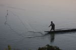 Fisherman at daybreak on the Mekong