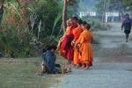 Giving of alms to monks in Muang Khong