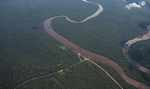 Road intersecting a river in Suriname